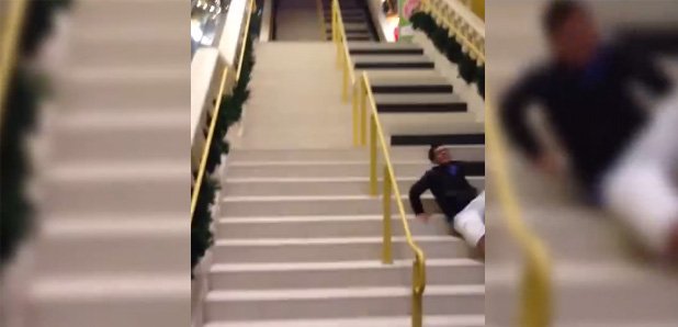 man falls down piano stairs